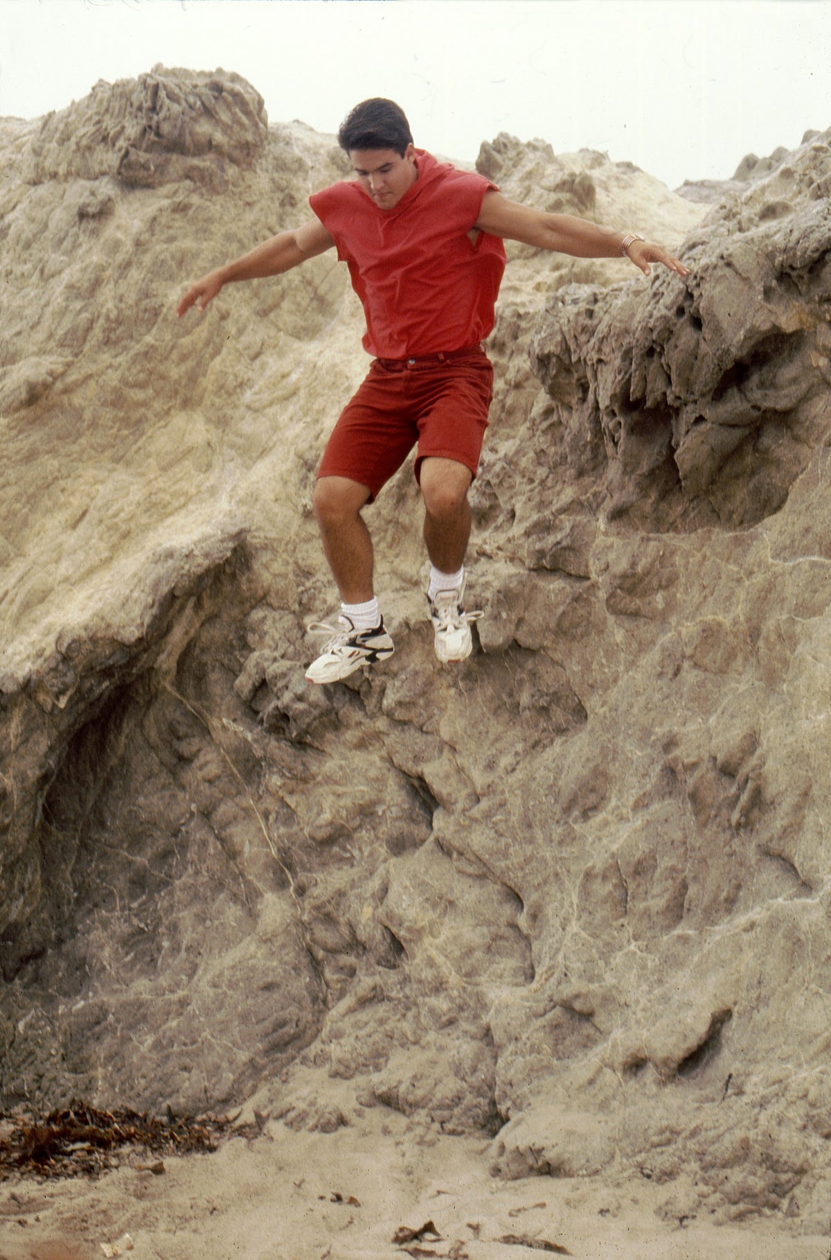 Austin St. John as Jason mid-flip off a 20-foot rock at Zuma Beach, a stunt cut from the episode, hand-signed by Austin St. John