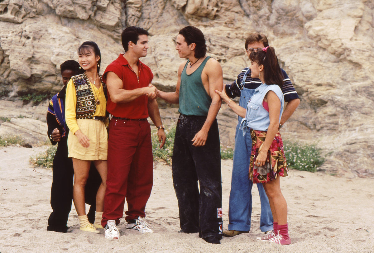 Red Ranger Jason shaking hands with Tommy at the end of Green with Evil as Kimberly looks on, hand-signed by Austin St. John