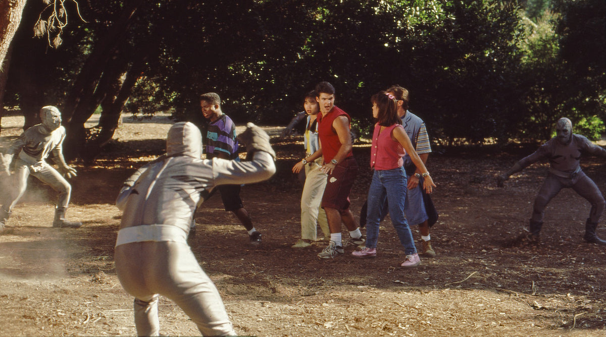 Unmorphed Mighty Morphin Power Rangers cast backed into a circle at Kenneth Hahn Park as Putties arrive, hand-signed by Austin St. John