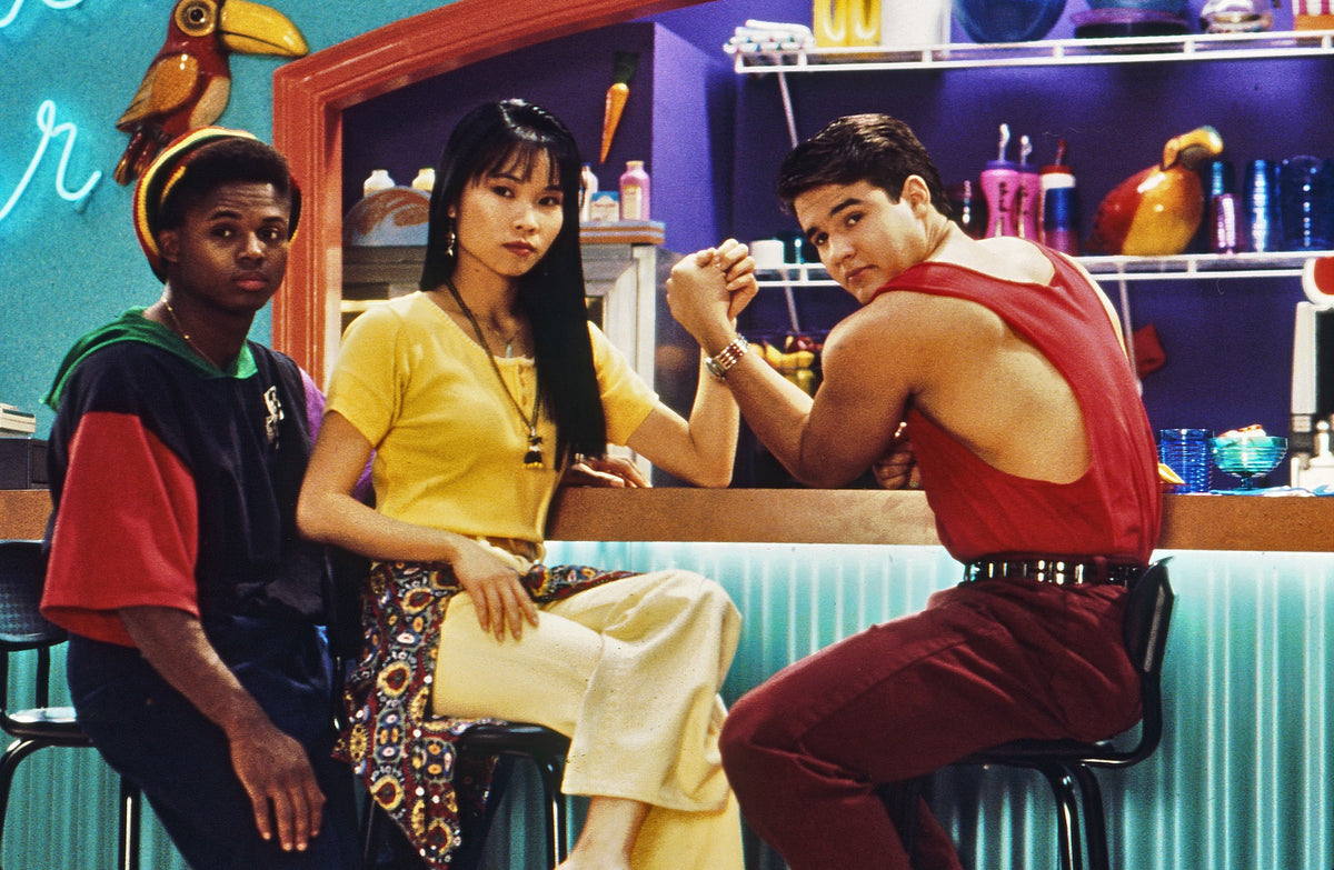 Austin St. John as Jason and Thuy Trang as Trini arm wrestling at the Juice Bar, behind-the-scenes photo hand-signed by Austin St. John