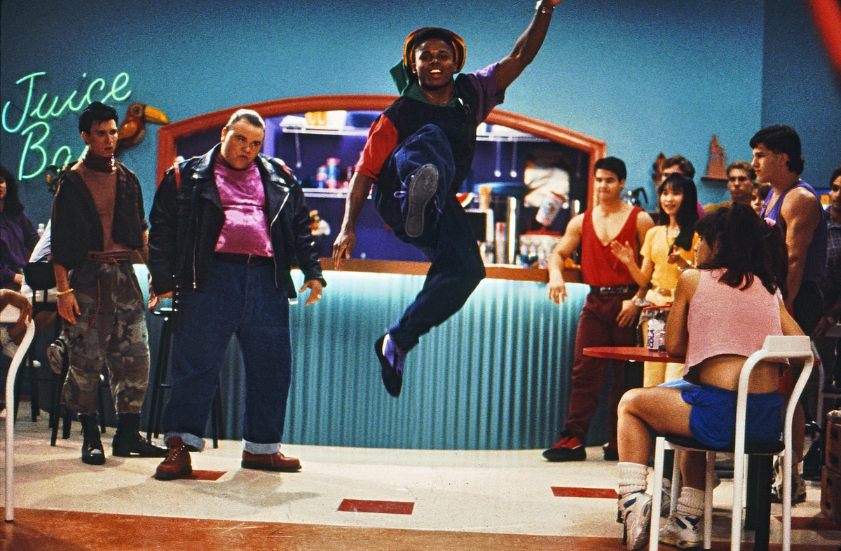 Walter Jones as Zack leaping mid-air in a dance move at the Angel Grove Juice Bar, hand-signed by Austin St. John